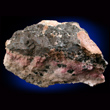 Alabandite on Rhodochrosite Matrix